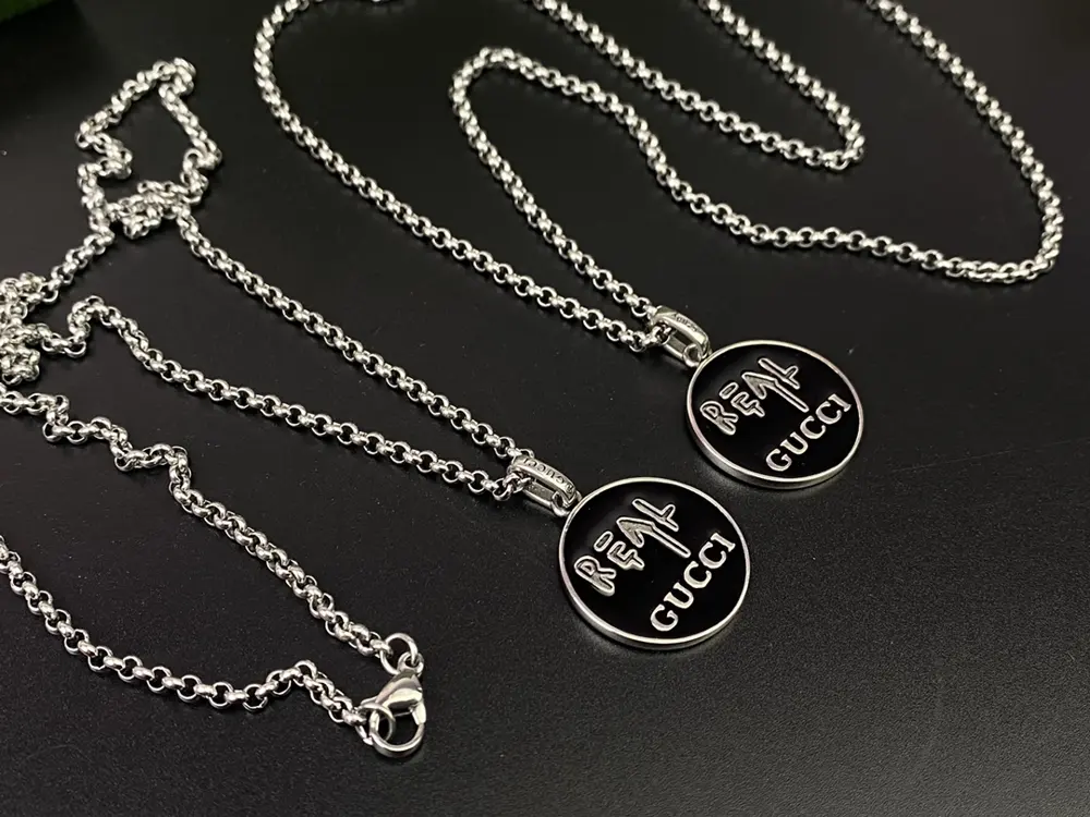Gucci black enamel double G round pendant necklace