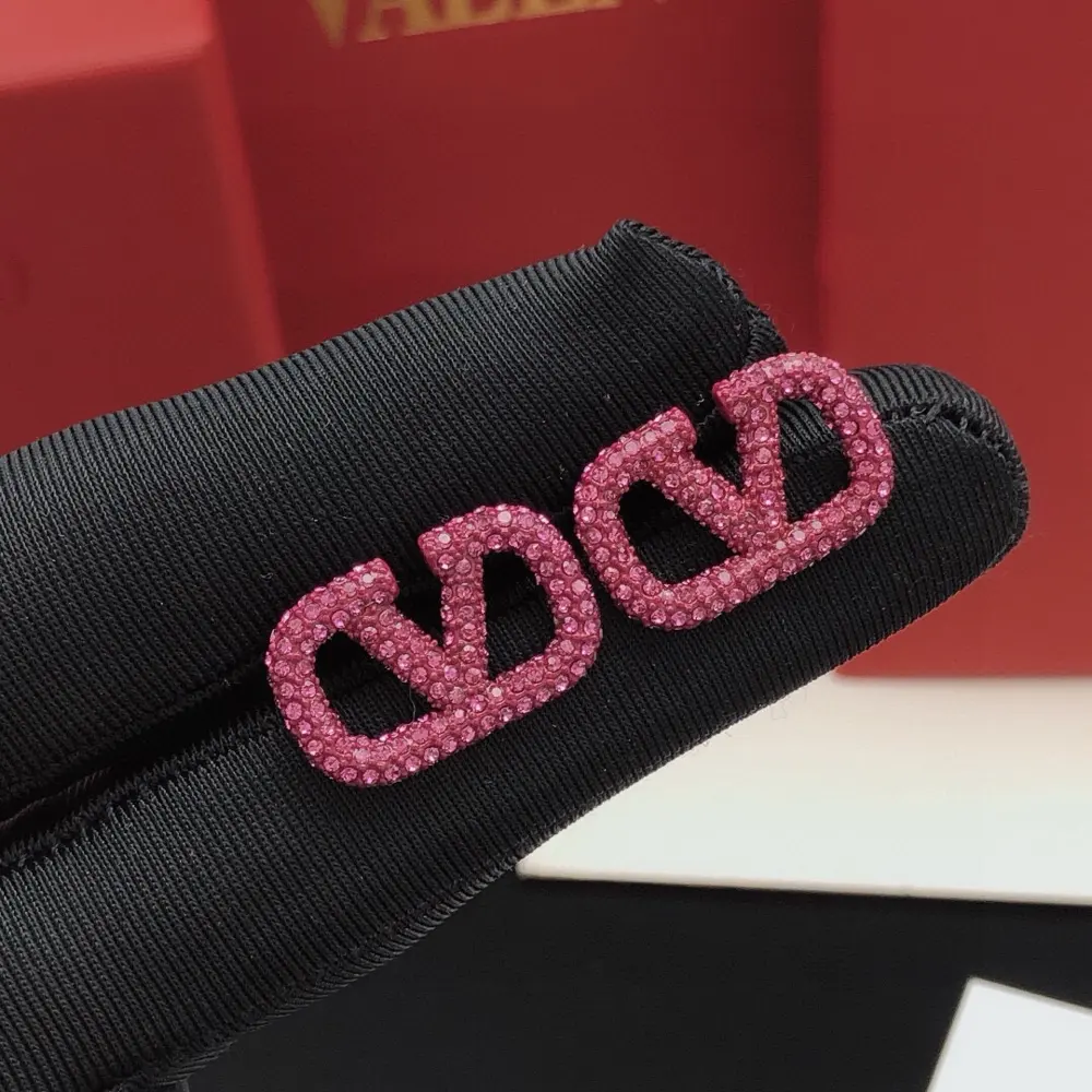 Valentino V-shaped earrings with diamonds purple and red