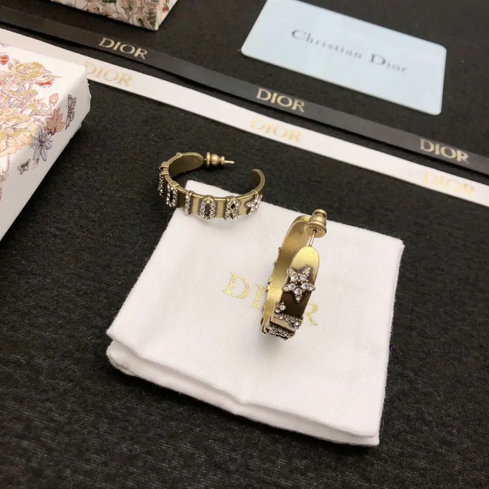 DIOR earrings. Same brass material as the counter. Best seller. Unique design. Retro and