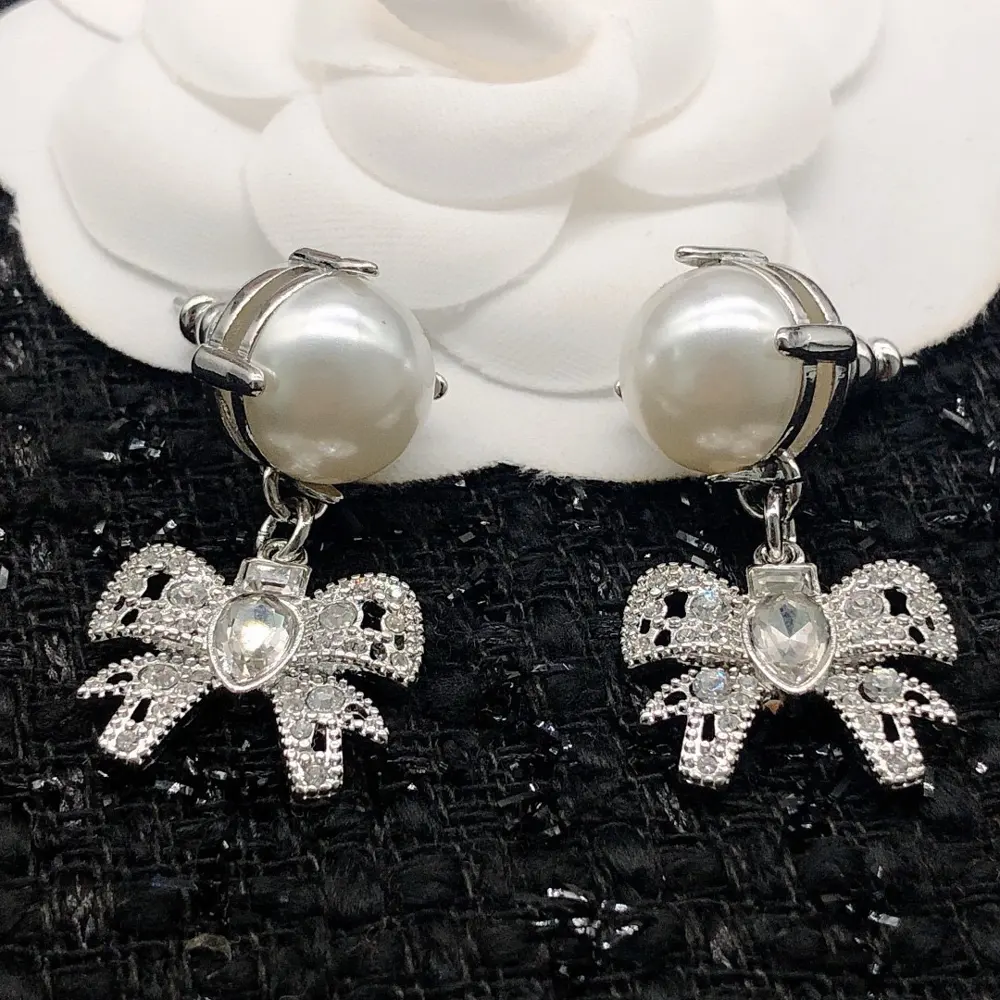 miumiu bow pearl earrings