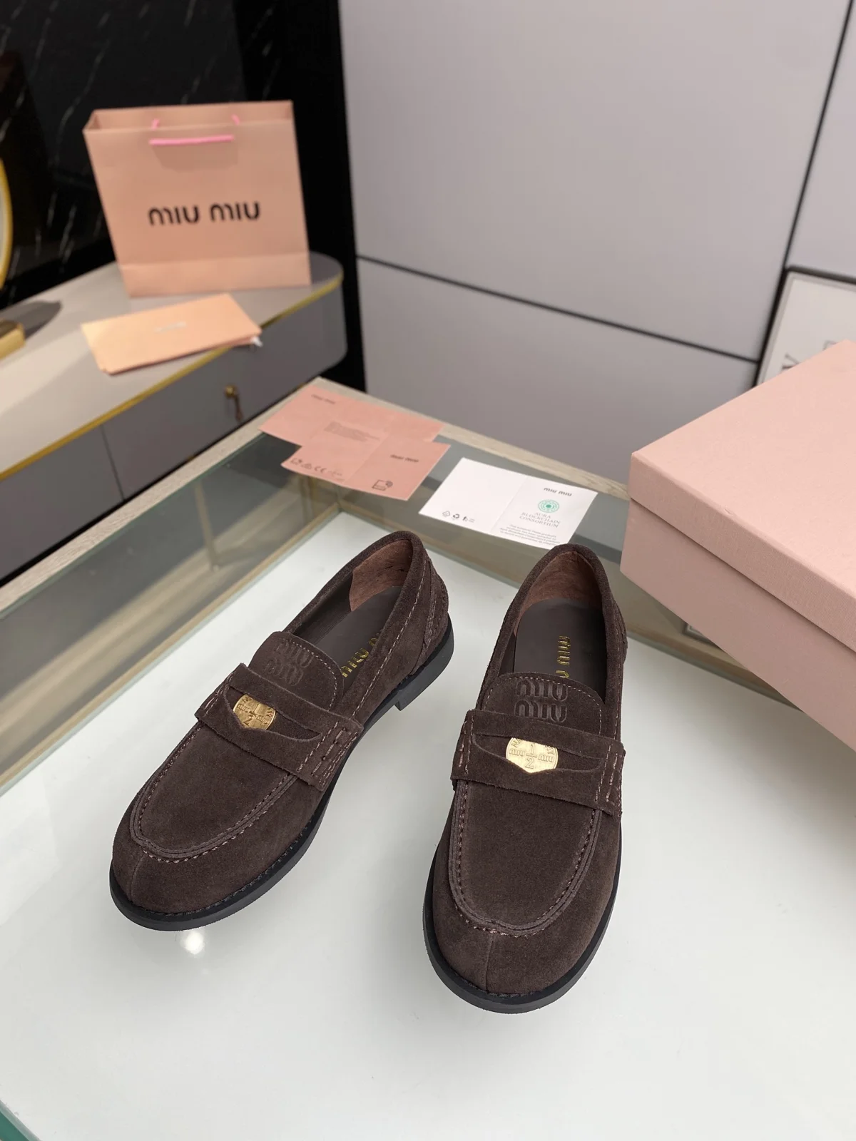 MIUMIU coin loafers