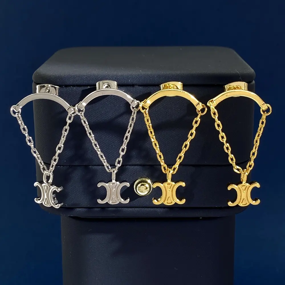Celine curved pendant chain polished engraved Arc de Triomphe parachute earrings