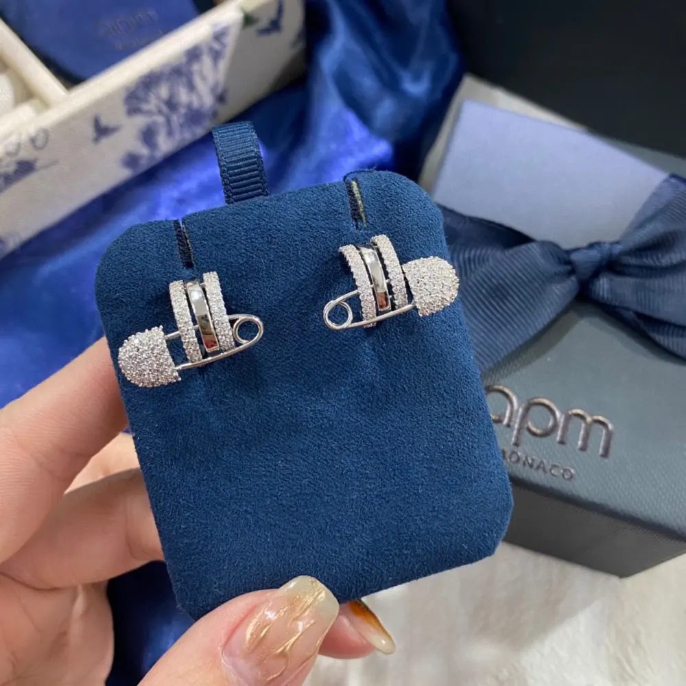 Apm monaco white gold safety pin earrings