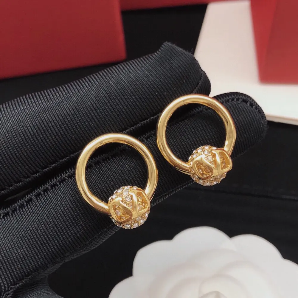 Valentino round ball earrings with diamonds