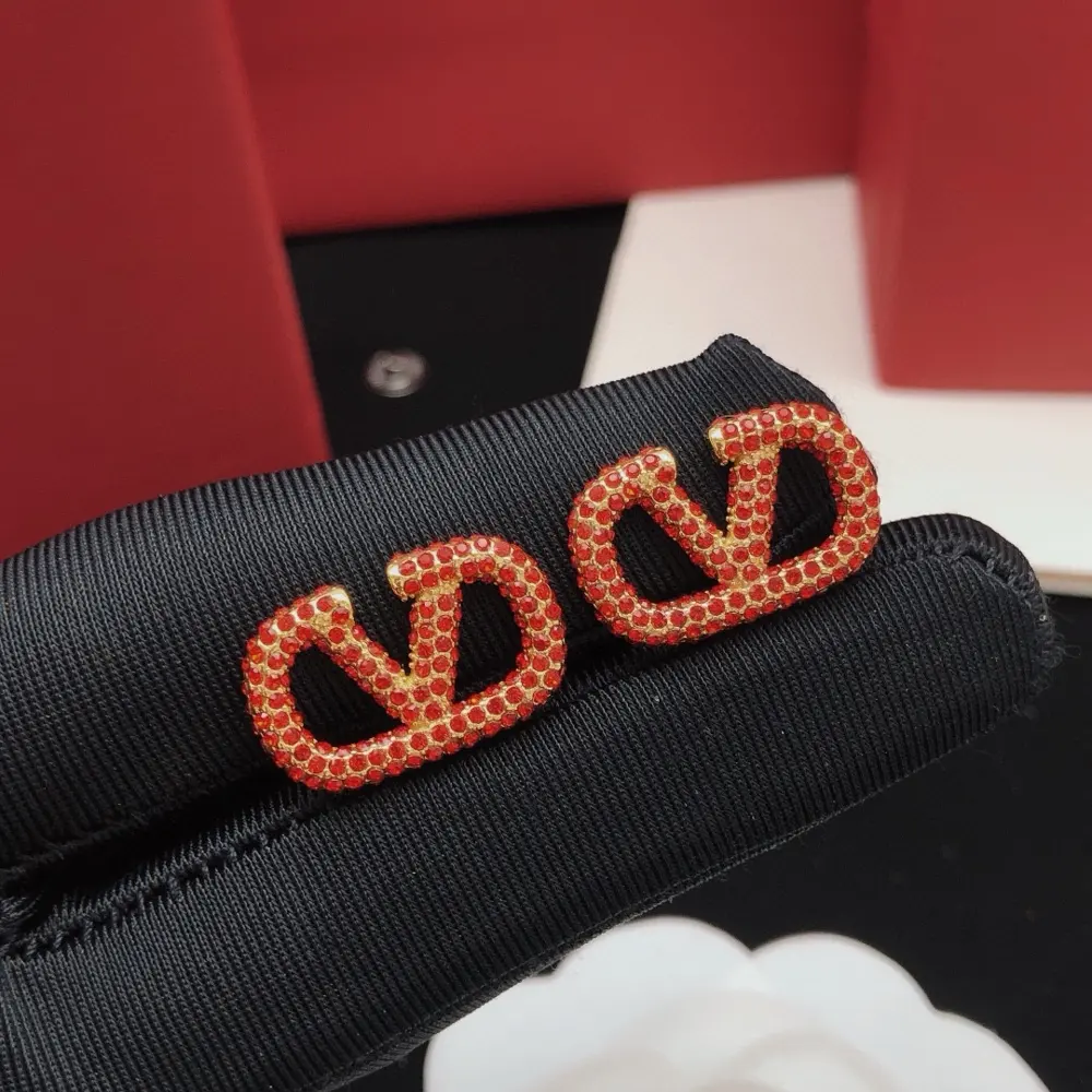 Valentino V-shaped earrings with red diamonds