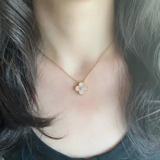 Van Cleef & Arpels natural pink shell with diamond-backed four-leaf clover necklace