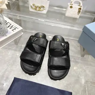 Prada’s latest Prada slippers are 90s-style slipper-style sandals that exude a feminine
