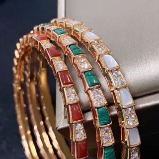 Bvlgari snake bone bracelet. White mother-of-pearl and green emerald malachite with red