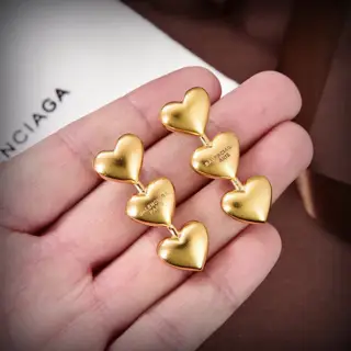 Balenciaga gold stud earrings