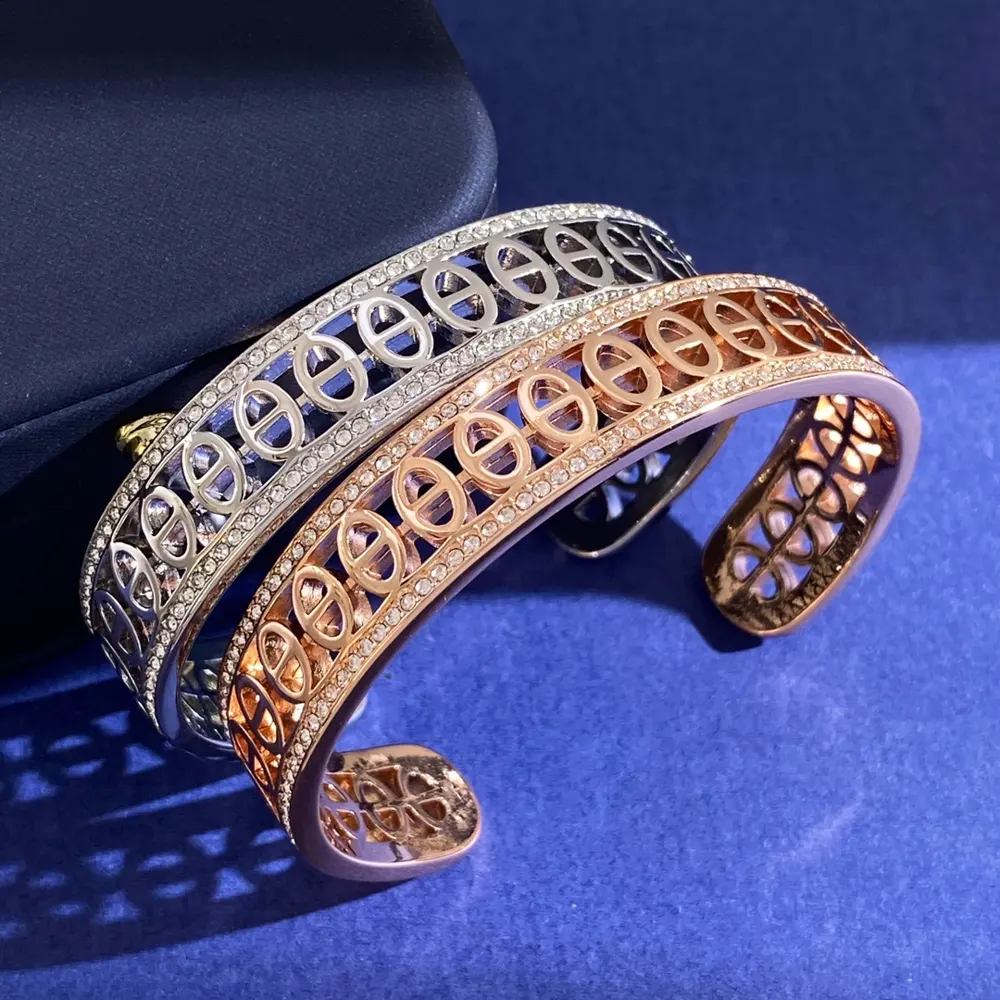 Hermès H C-shaped polished pig nose element diamond-studded open bracelet