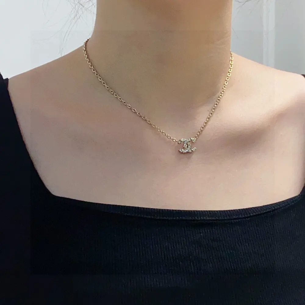 Chanel Double C champagne gold diamond small pendant necklace