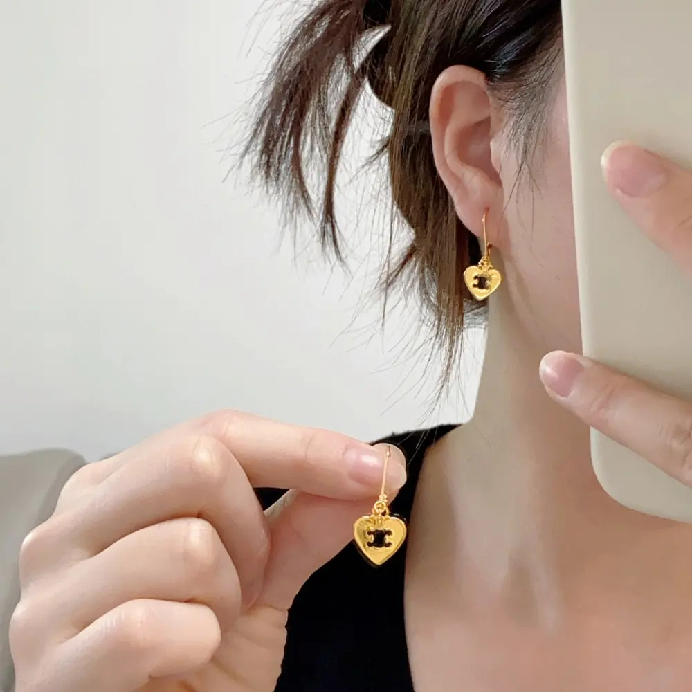 Celine Arc de Triomphe hollow heart earrings