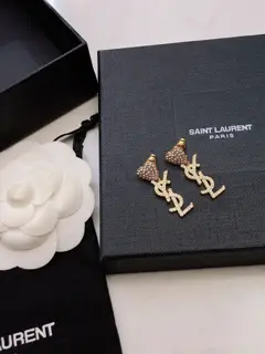 Yves Saint Laurent letter pendant with diamond heart earrings and studs