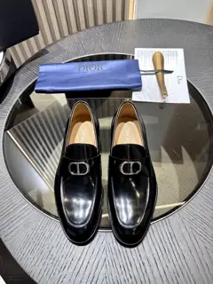 The Dior Granville loafer is a modern take on the dress shoe. Crafted in beige and black