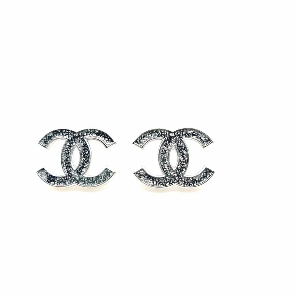 Chanel white gold cc earrings