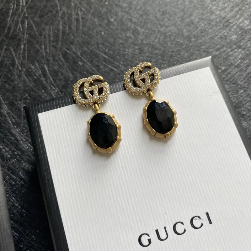 Gucci stud earrings Original logo print