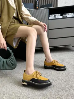Chanel leather shoes with gold hardware buckle and chain