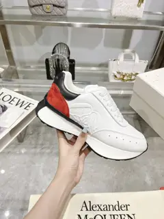 Alexander McQueen Sprint sports couple style. The side of the shoe is decorated with a