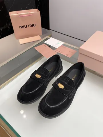 MIUMIU coin loafers