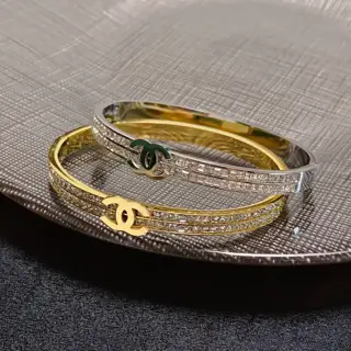 Chanel engraved C double row diamond set gold and silver bracelet