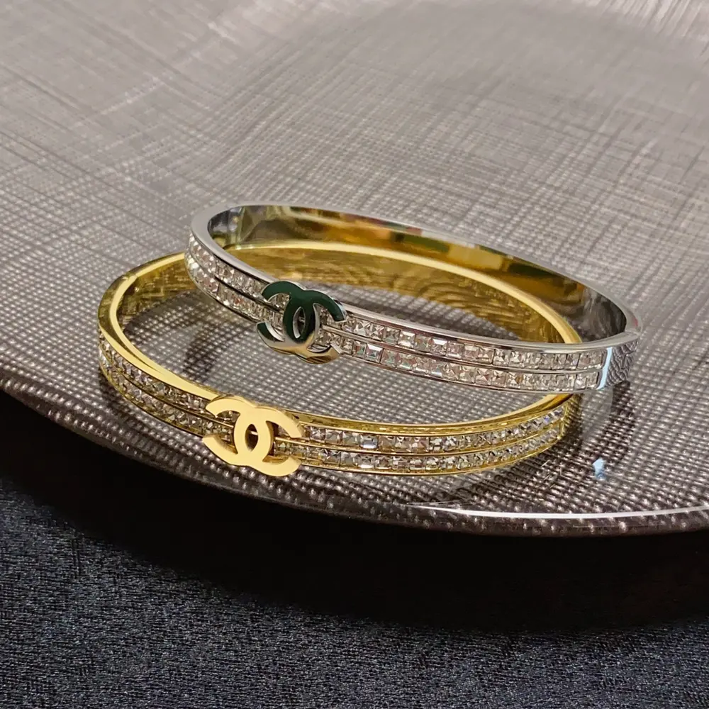 Chanel engraved C double row diamond set gold and silver bracelet