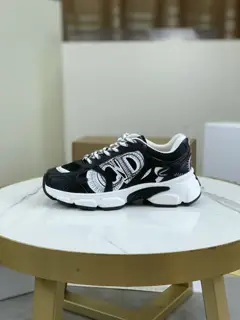 Dior CHRONO shoes have a lot of silver shiny structures with gray mesh materials. The soles