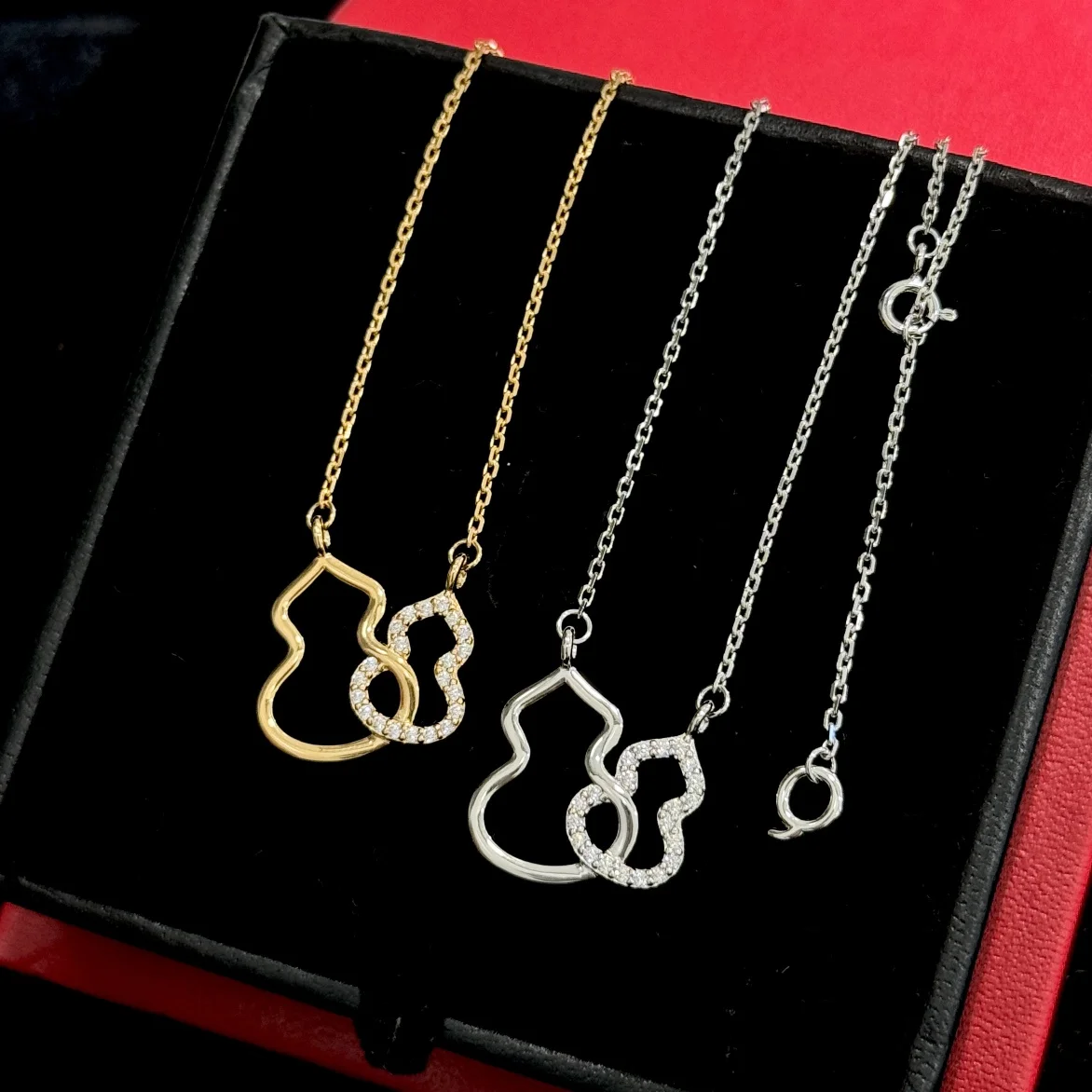 Qeelin half diamond double gourd necklace. Gourds are often used to represent fortune