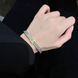Chanel double-row diamond-set gold and silver bracelet with the letter C