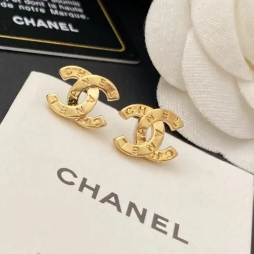 Chanel carved letter stud earrings