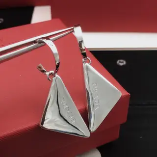 [Prada’s latest triangular ear hook]