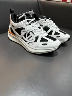 Valentino low-top sneakers are crafted from imported mesh fabrics and enhanced with zigzag