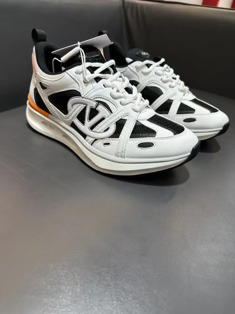 Valentino low-top sneakers are crafted from imported mesh fabrics and enhanced with zigzag
