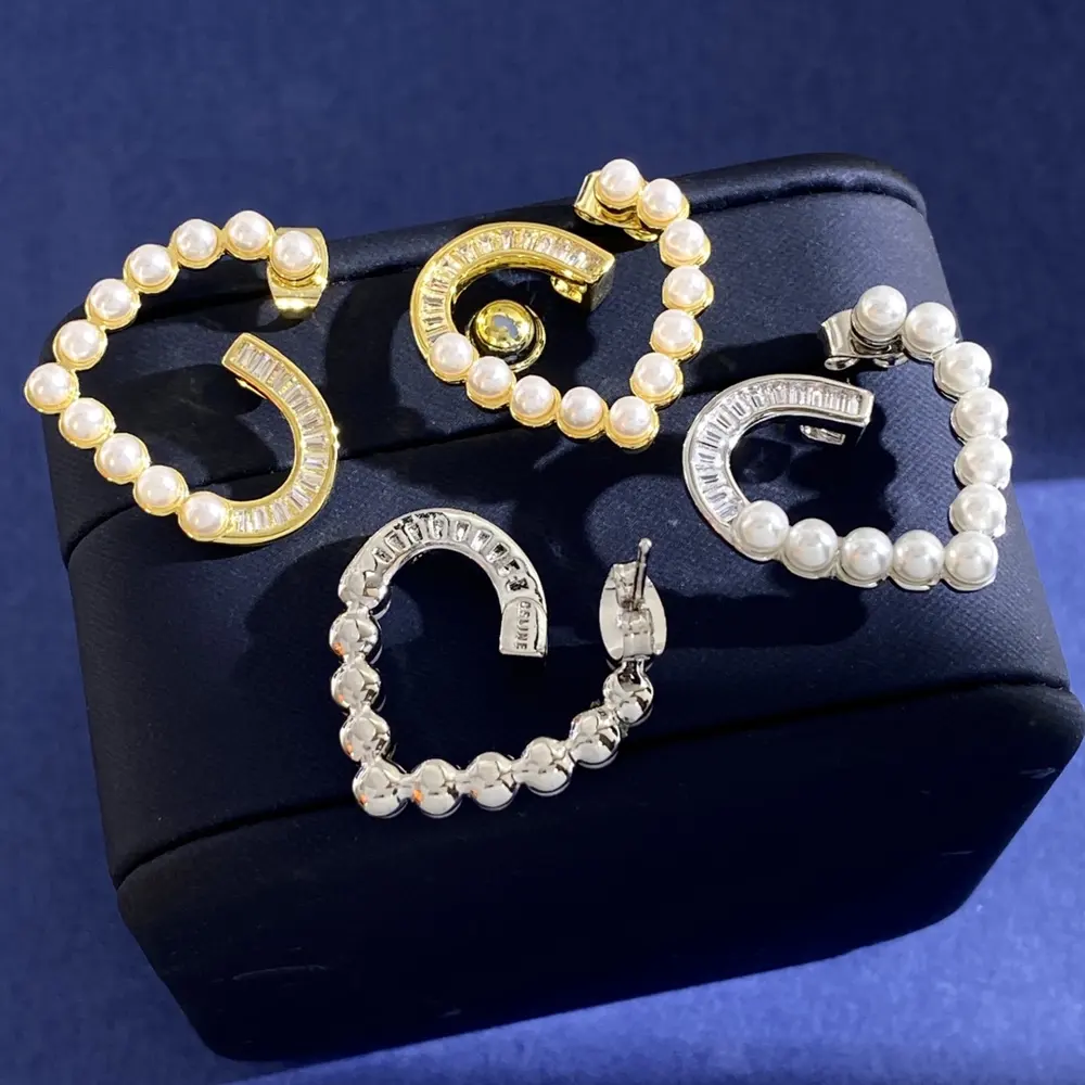 Celine hollow heart-shaped small pearl and horse-eye diamond earrings