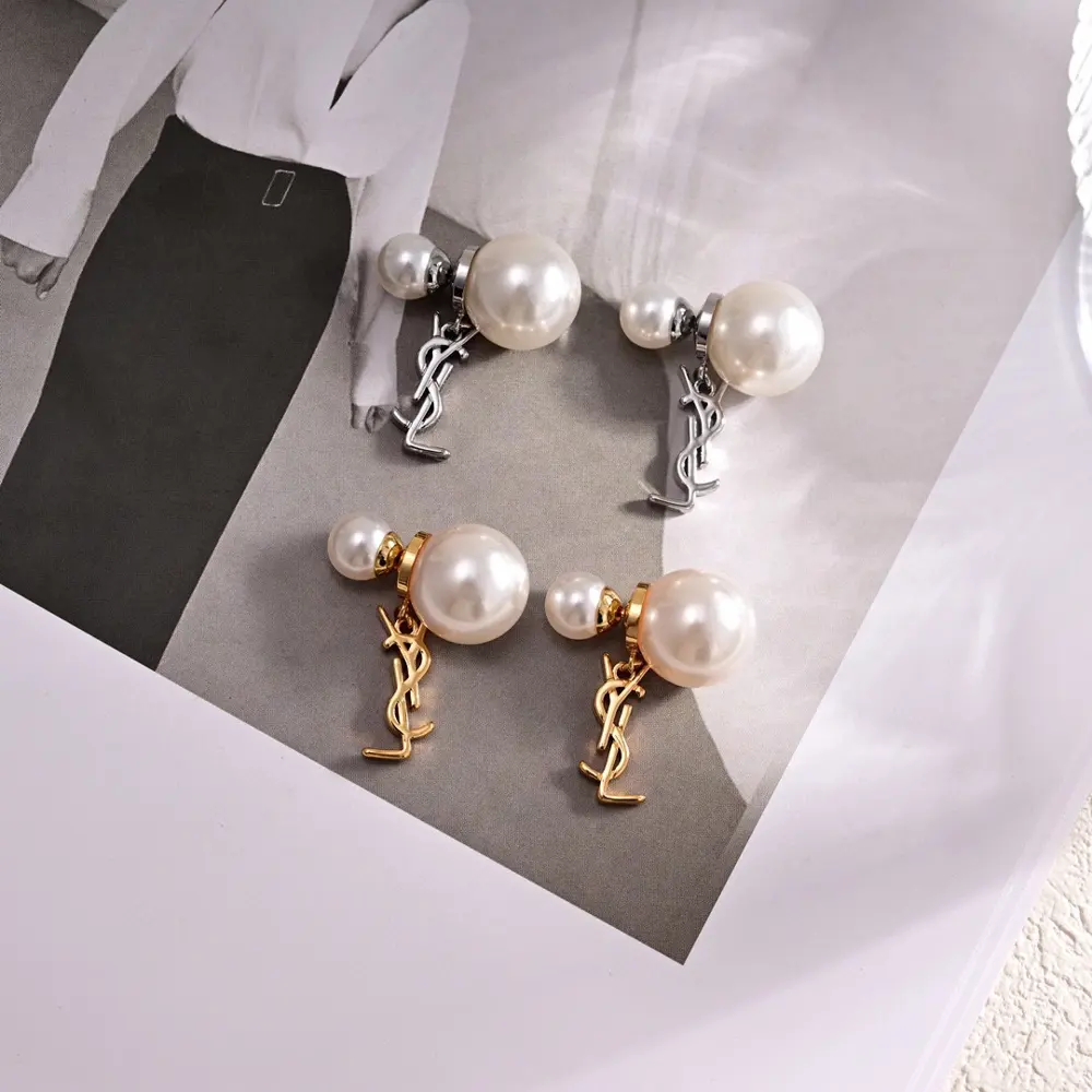 Yves Saint Laurent letter pearl earrings