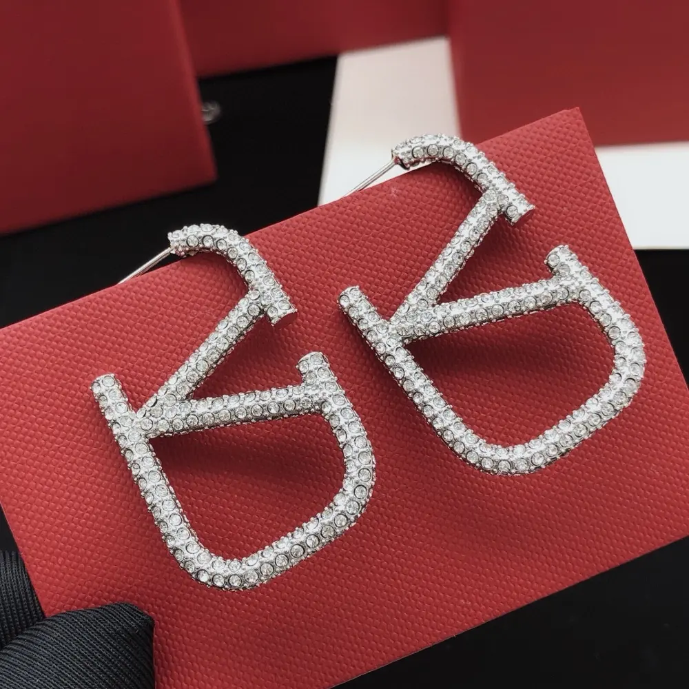 Valentino large size v-shaped earrings with full diamonds