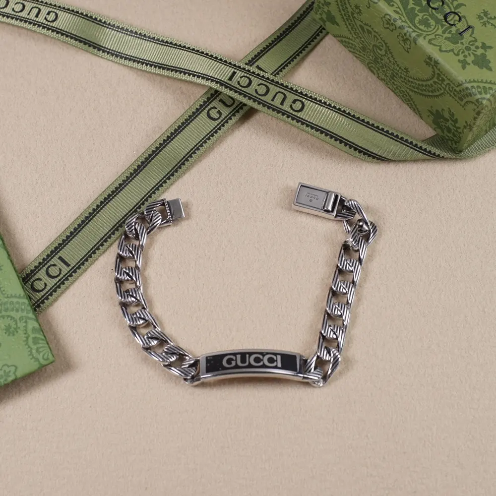 Gucci black enamel bracelet with lettering
