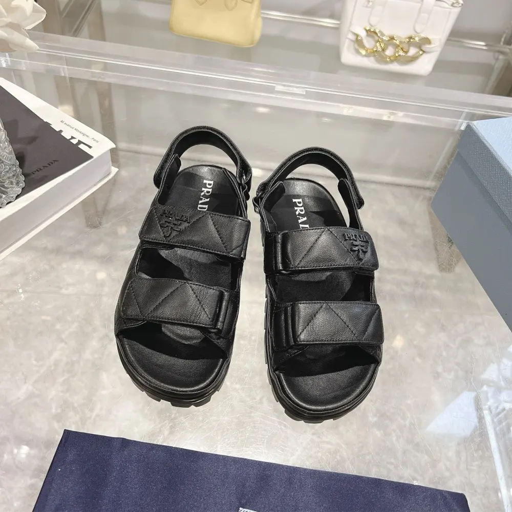 Prada sheepskin sandals combine sporty elements to create a unique fashion statement