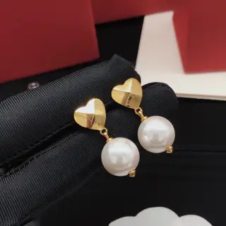 Valentino heart earrings with glossy pearls