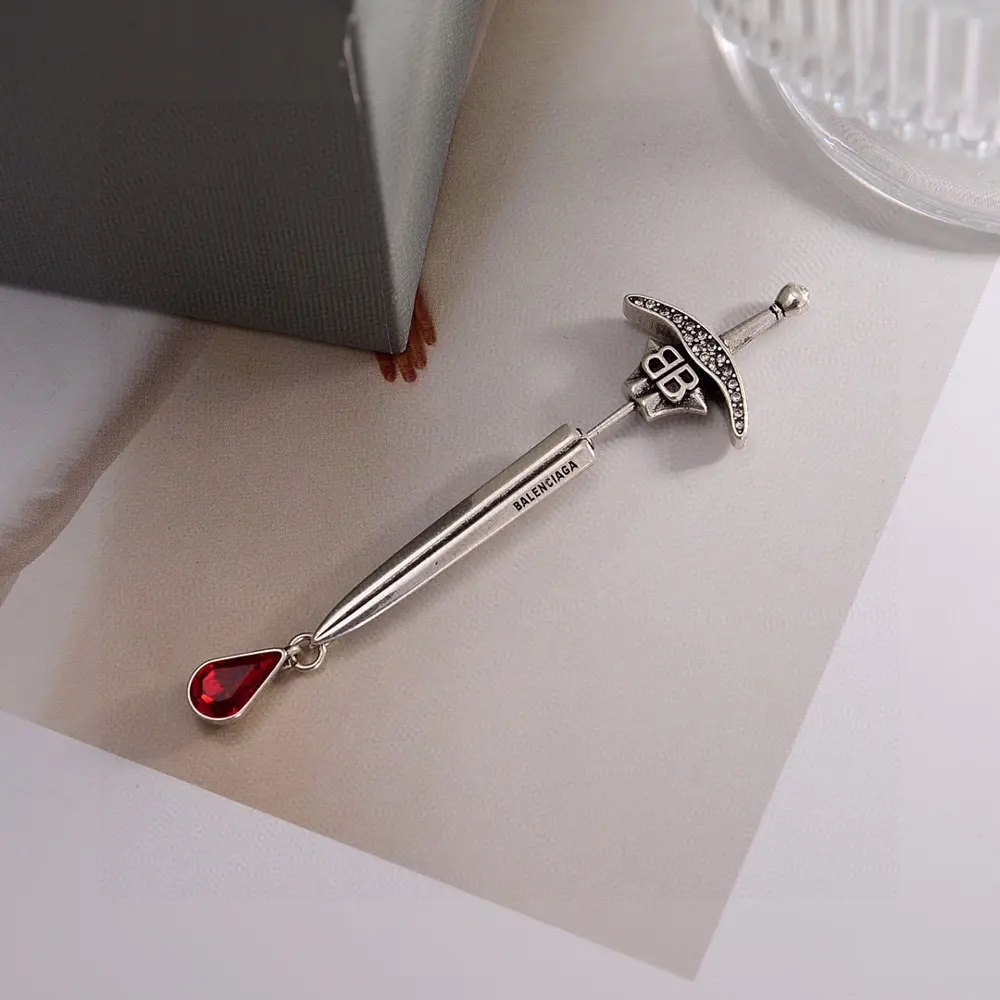 Balenciaga sword earrings