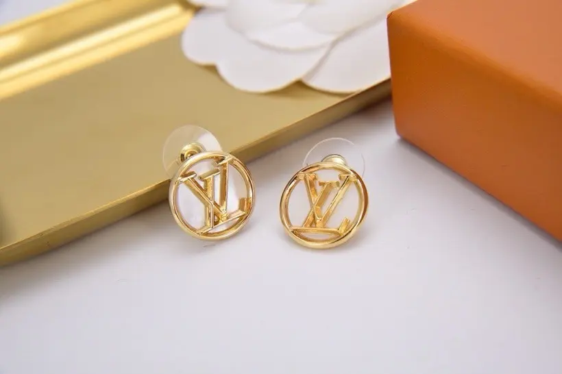Louis Vuitton white shell earrings with lettering