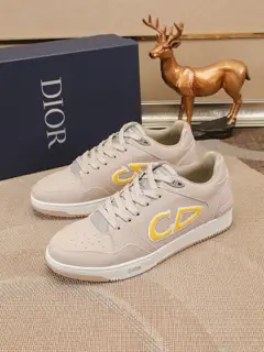 Dior B57 mid-top sneakers are crafted from smooth black and cream leather with beige suede