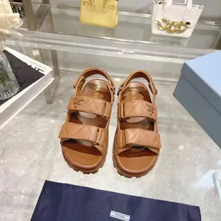 Prada sheepskin sandals combine sporty elements to create a unique fashion statement