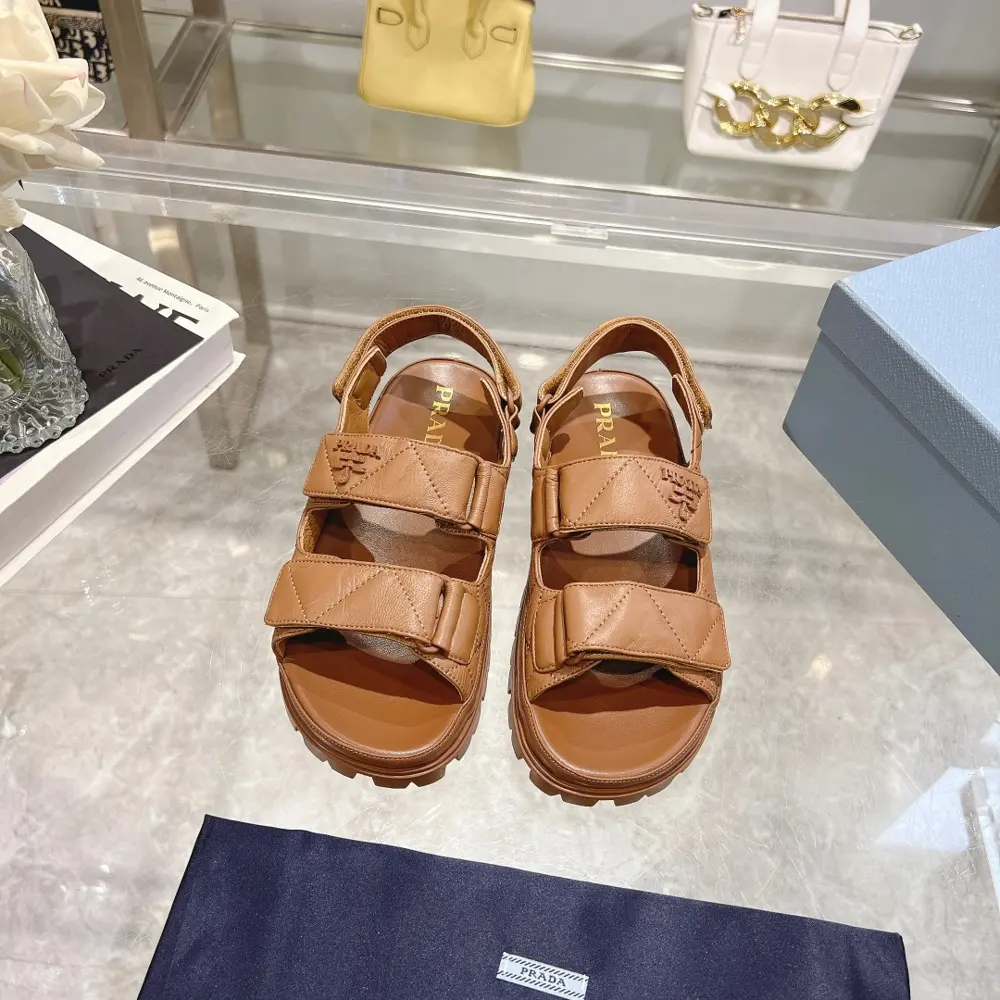 Prada sheepskin sandals combine sporty elements to create a unique fashion statement