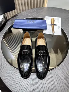 The Dior Granville loafer is a modern take on the dress shoe. Crafted in beige and black