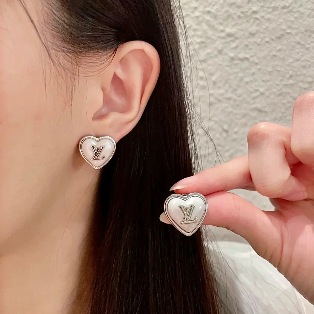 Louis Vuitton vintage letter earrings
