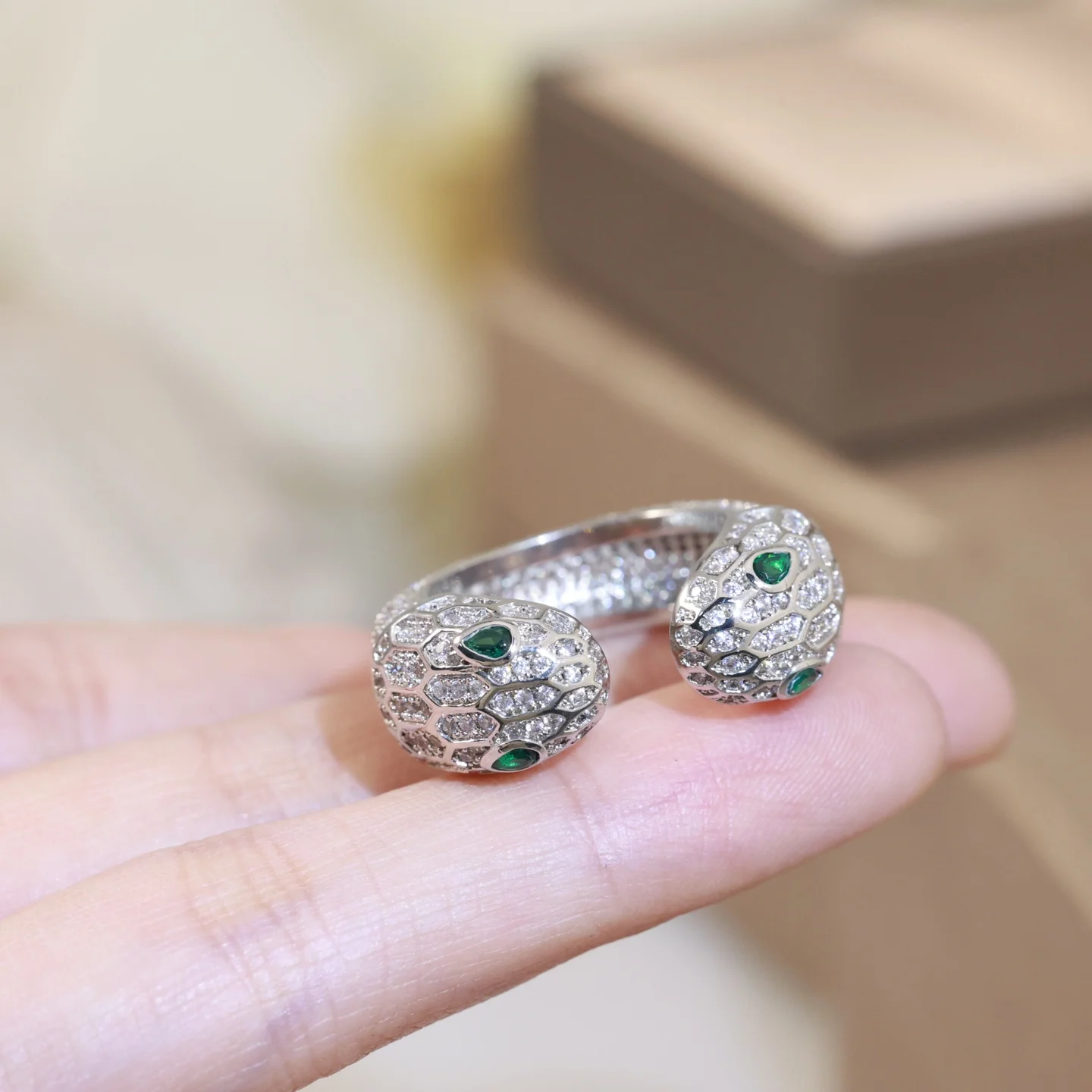 Bvlgari This ring is pavé-set with diamonds on its scales