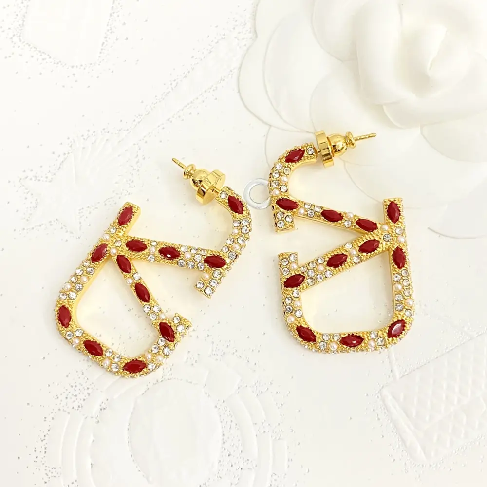 Valentino 3D hollow letter V rhinestone earrings