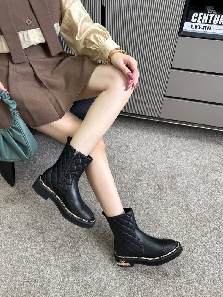 Chanel ankle boots with gold hardware buckle and chain
