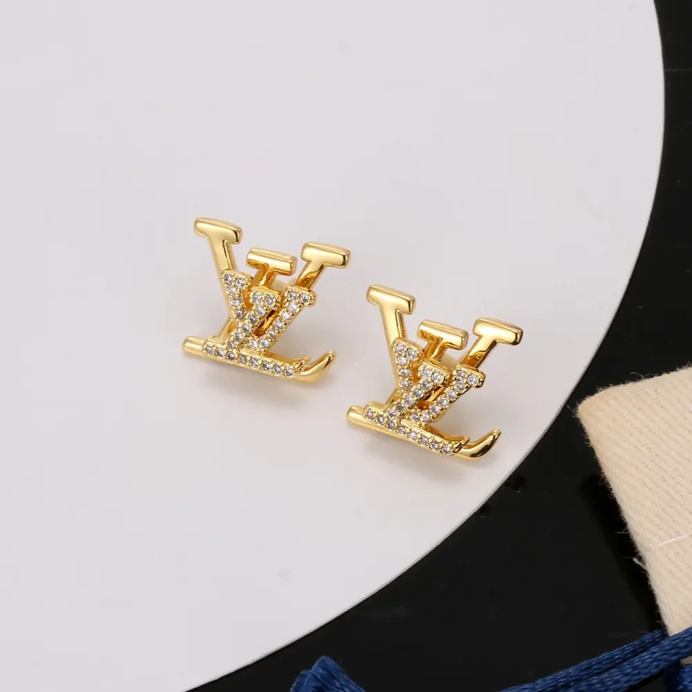 Louis Vuitton gold letter earrings