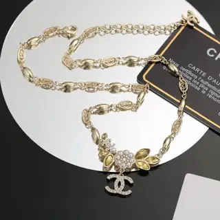 Chanel’s latest gold necklace with letter camellia